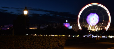 Ferris wheel lit up at night