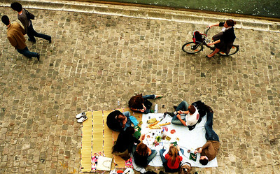 people having a picnic in Paris near the Seine