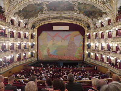 people seated inside ornate theater