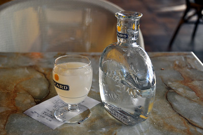Glass of Pastis and empty bottle