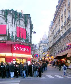 Crowds comb through the merchandise.