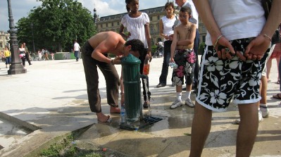 drinking from water fountain in Paris