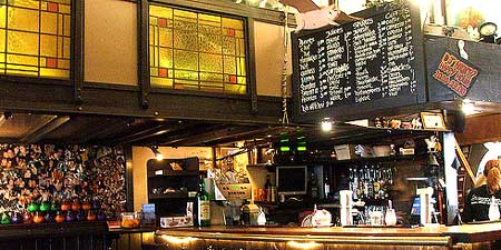 stained glass window above bar area