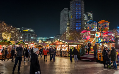 Christmas market stalls lit up at night