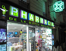 The green cross marks a Paris pharmacy.