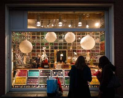 people looking into store window