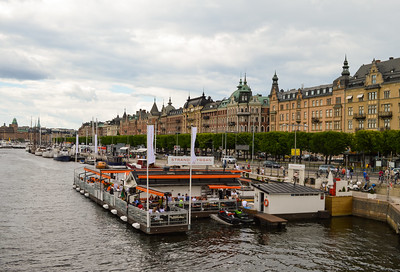 people dining on large floating dock in Stockholm