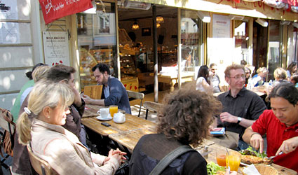 people dining at Le Coquelicot's outdoor tables