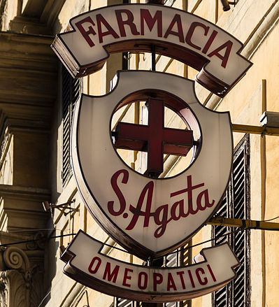white and red pharmacy sign