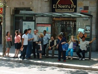 people waiting at bus stop