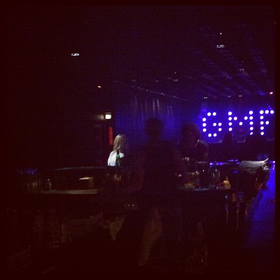 GMF sign in purple lights in dark room