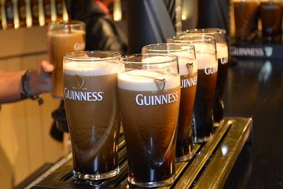 bartender pouring pints of beer
