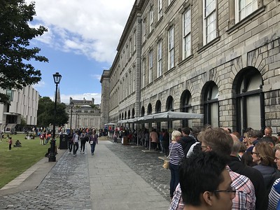 line of people outside Trinity College Library in London