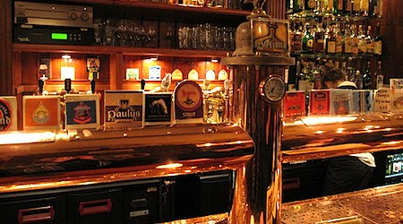on-tap beers in dimly lit Bar t'Arendsnest in Amsterdam