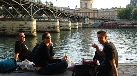 people eating snacks by river