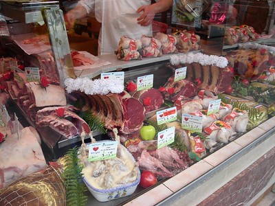 counter full of meats at butcher shop