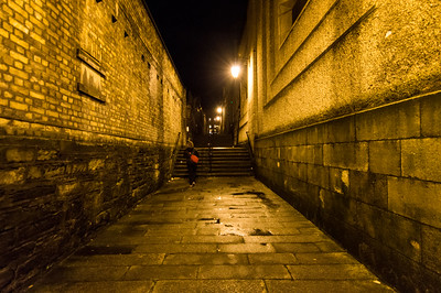 woman walking alone in alley in Dublin at night