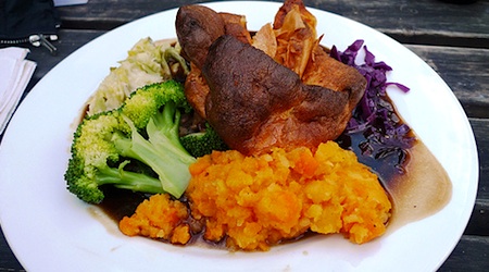 roast and vegetables on plate