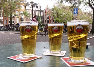 beers on table with row homes in background