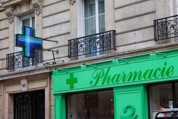 Green pharmacy sign in Paris