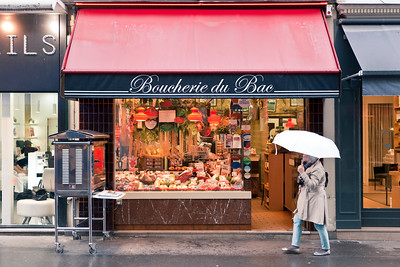 person walking by shop in Paris