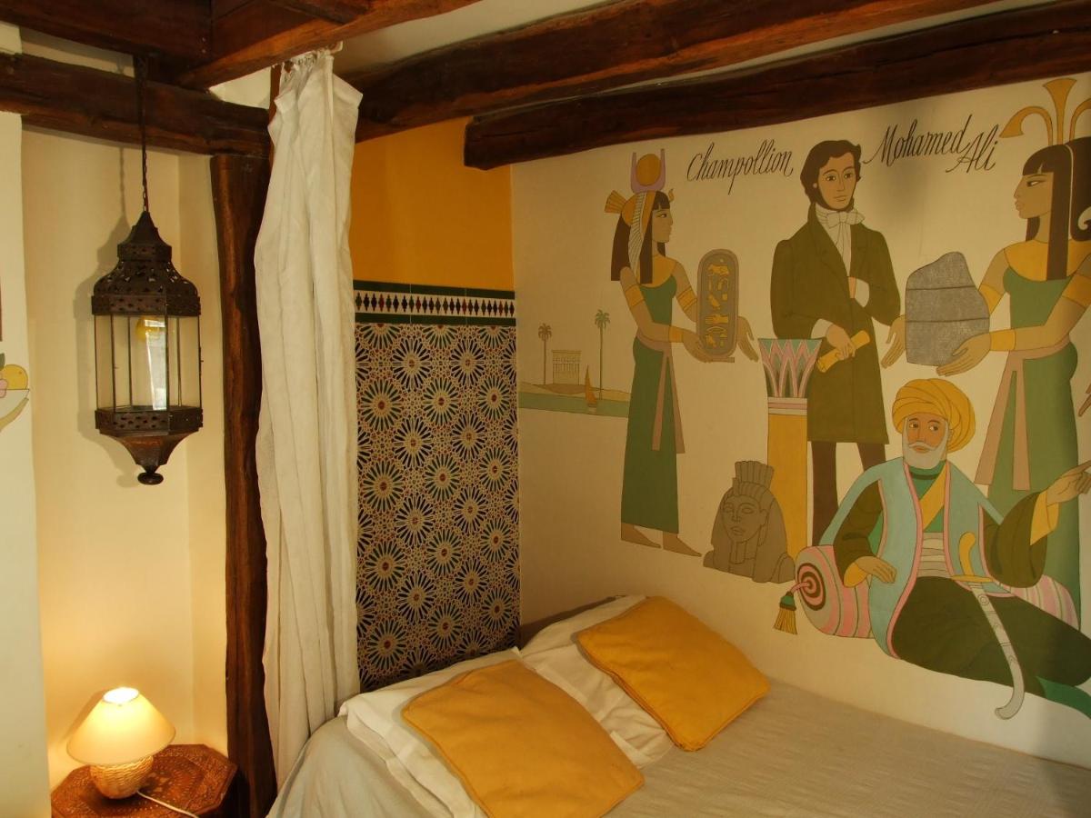 yellow hotel room with wall mural