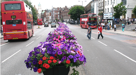 median filled with flowers on street in Islington