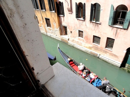 The view of a passing gondola from a room at the Doni. (And yes, the gondolier is texting.)