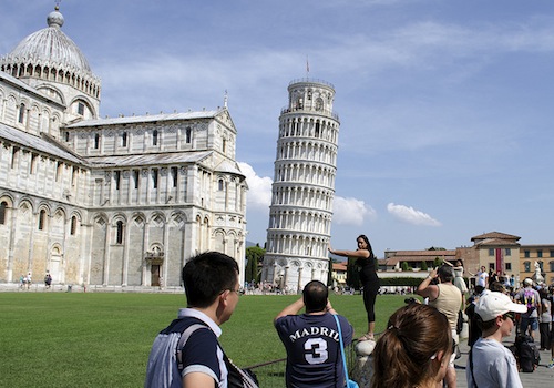 tourists taking photos of Leaning Tower of Pisa