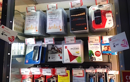 Options, options... Looking over the SIM cards available for purchase at a "Relay" newsstand at Charles De Gaulle airport. Photo: EuroCheapo