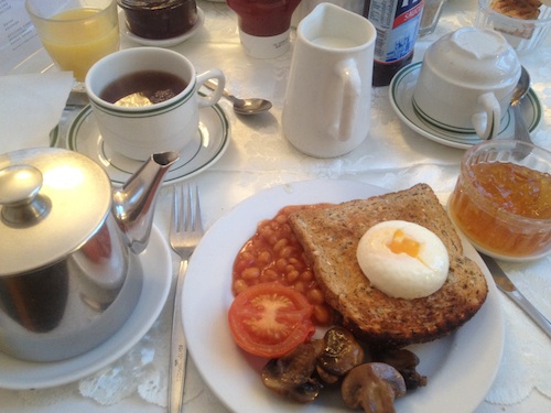 full English breakfast with egg, toast, beans, tomato