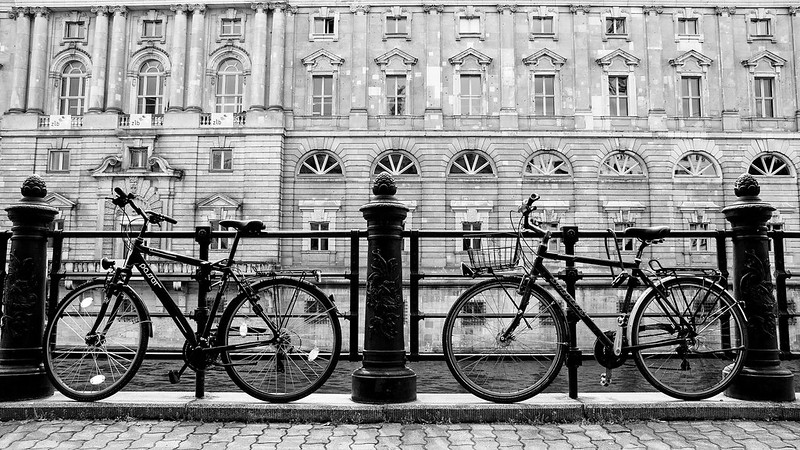 bikes against rail outside old building