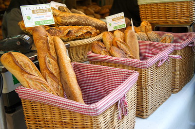 fresh bread in baskets at a market stall