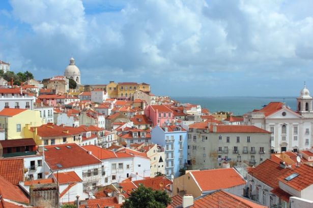 aerial view of rooftops and sea in Lisbon