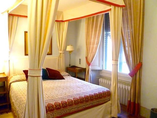 Canopy beds add a touch of flare to this cozy B&B.