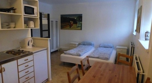 small studio guest room with kitchenette