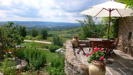 stone patio overlooking rolling green hills