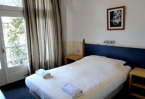 The rooms are bright, simple, and incredibly affordable at the Abba Hotel. Photo: EuroCheapo