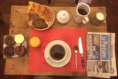 Paris Hotel Breakfast with croissant and coffee, which you might skip if you want to Save on Paris hotels