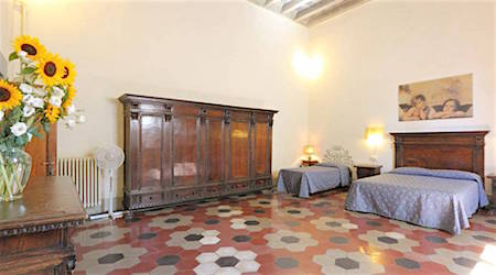 hotel room with patterned floors, the hotel Bavaria, one of the best budget hotels in Florence