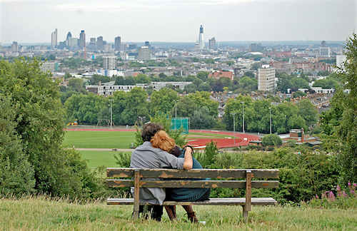two people sitting on bench