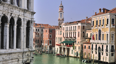 Venice canals lined in pink and beige buildings