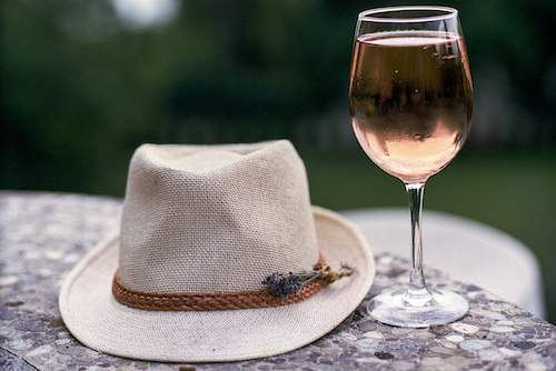 glass of fröccs near a hat