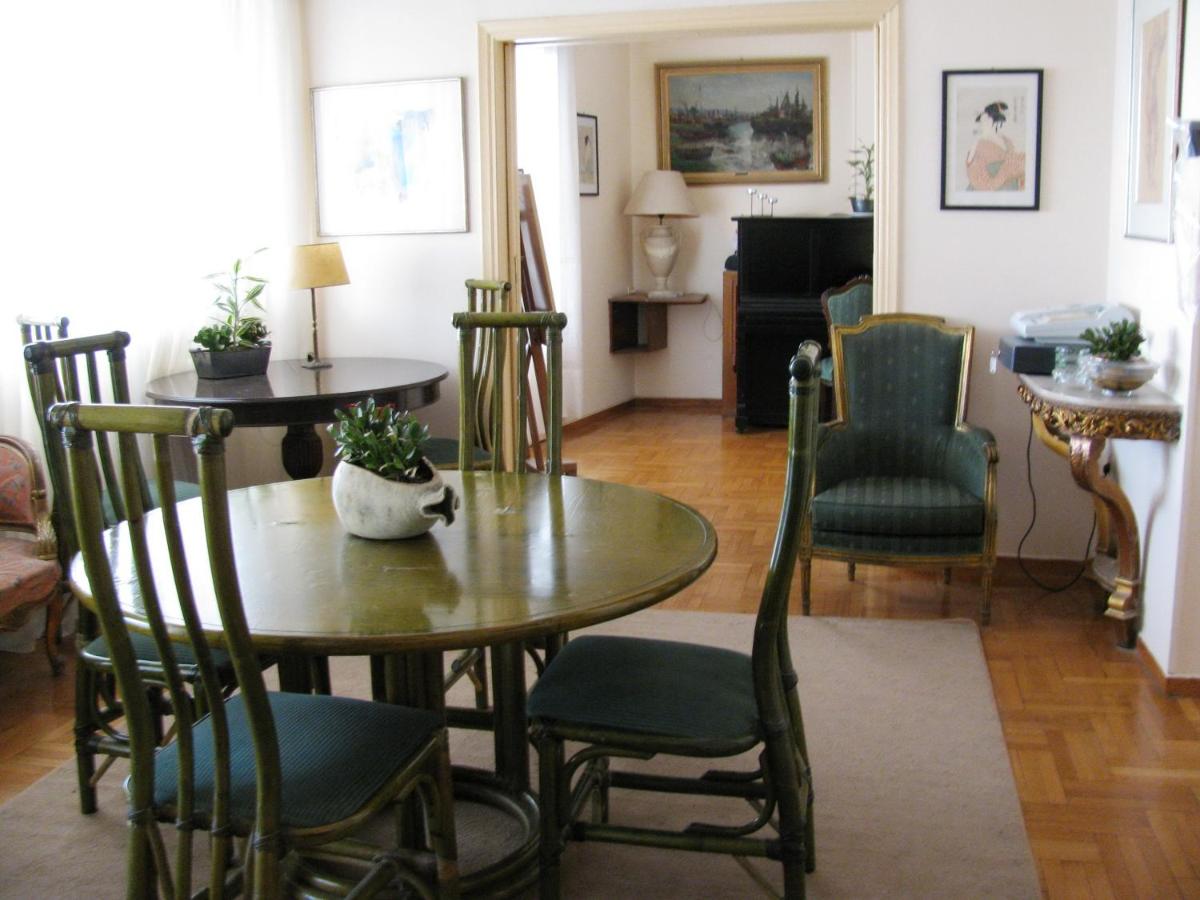 green table and chairs at Art Gallery Hotel in Athens, Greece