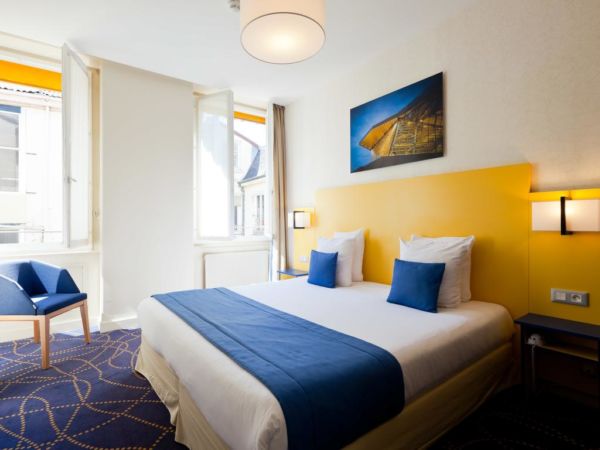 blue and yellow hotel room