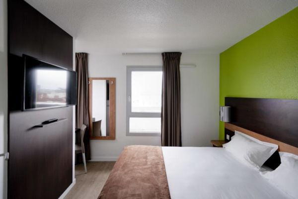 green and brown hotel room