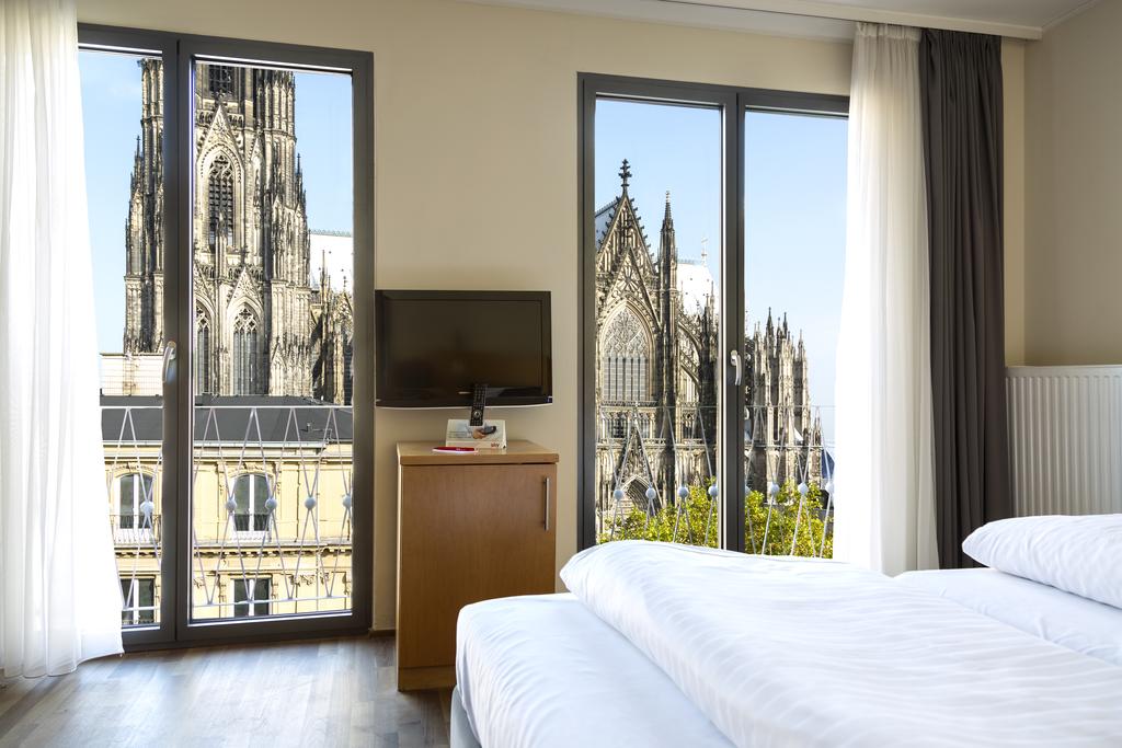hotel windows with views of an ancient cathedral