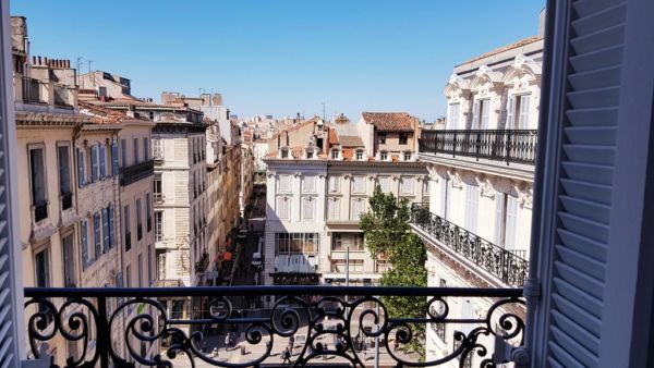 view of Marseille from wrought iron balcony