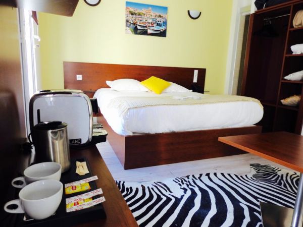 yellow hotel room with zebra rug