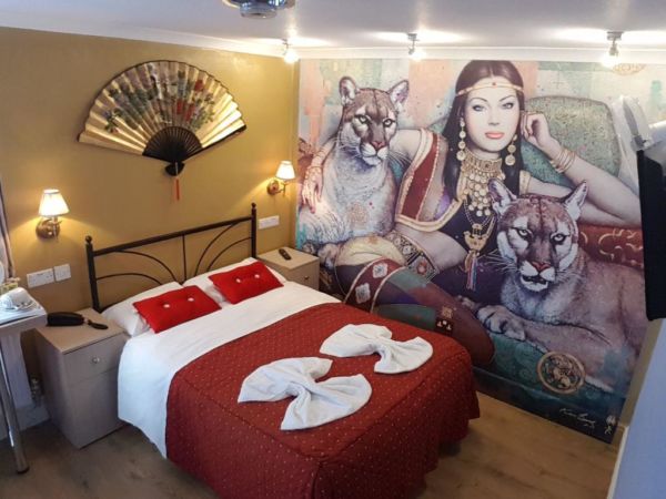 hotel room with large wall mural